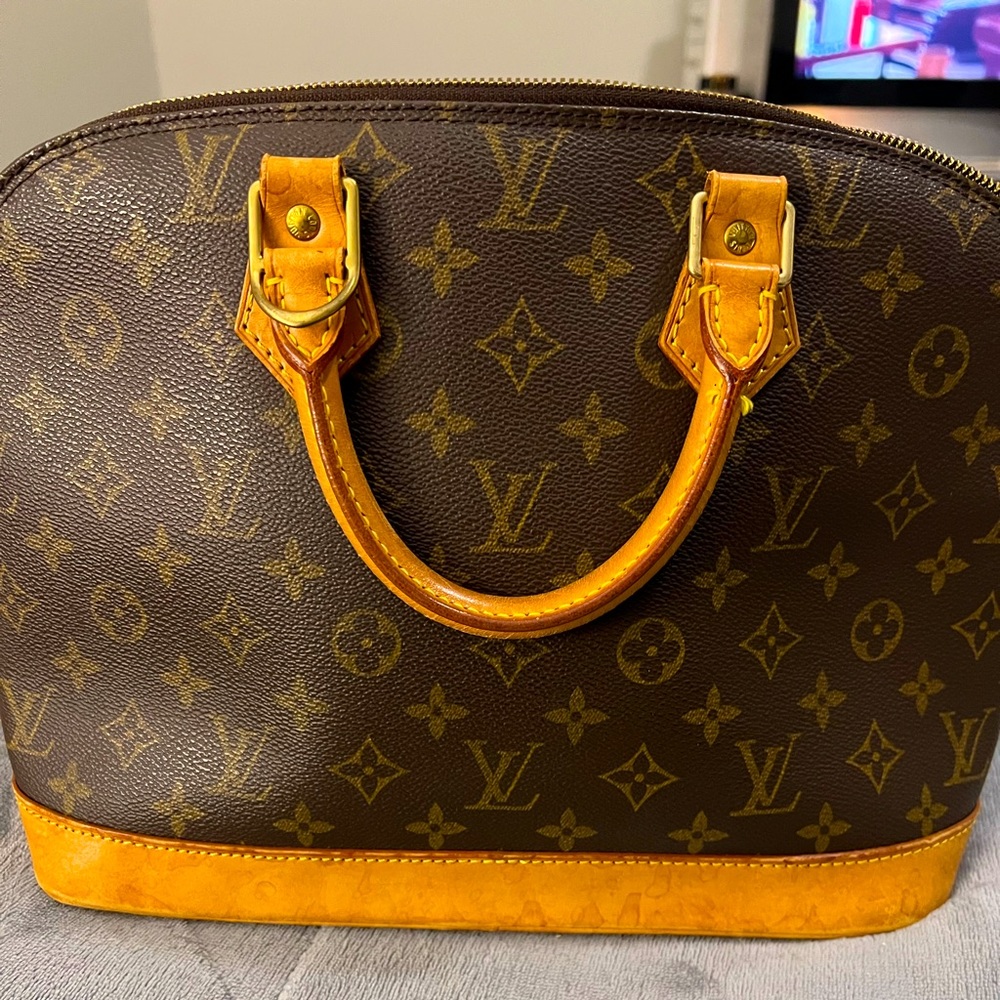 LV Authentic Alma PM leather handbag